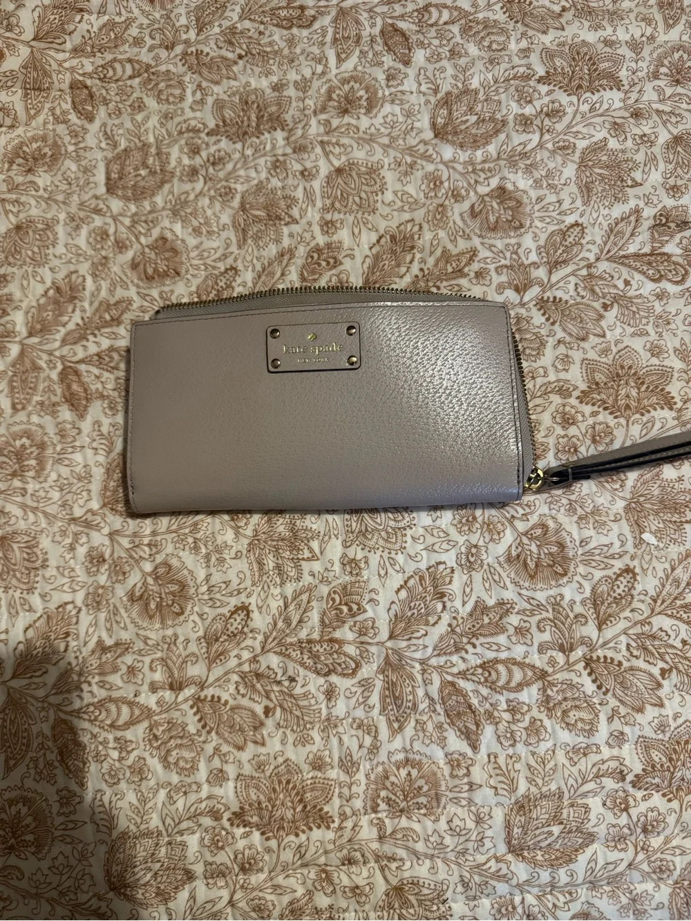 kate spade pebble leather wristlet in taupe